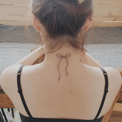 neck bow tattoo|cute bow tattoos.